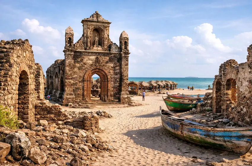 st. augustine tower ruins and boats goa